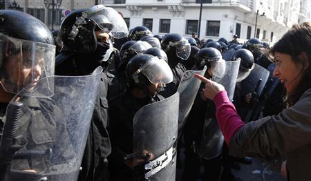 Tunisian protesters clash with riot police during demonstration after death of Tunisian opposition leader Belaid, outside Interior ministry in Tunis